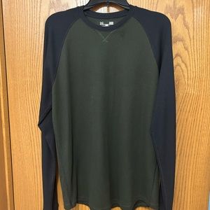 Used Large long sleeve Under Armor shirt. Main color is green with black sleeves
